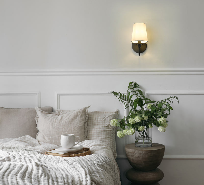 Gianna 1 Light 5.5" Wall Sconce in Matte Black in a room setting