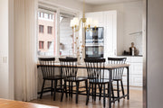Gianna 5 Light 26" Chandelier in Modern Gold in a room setting