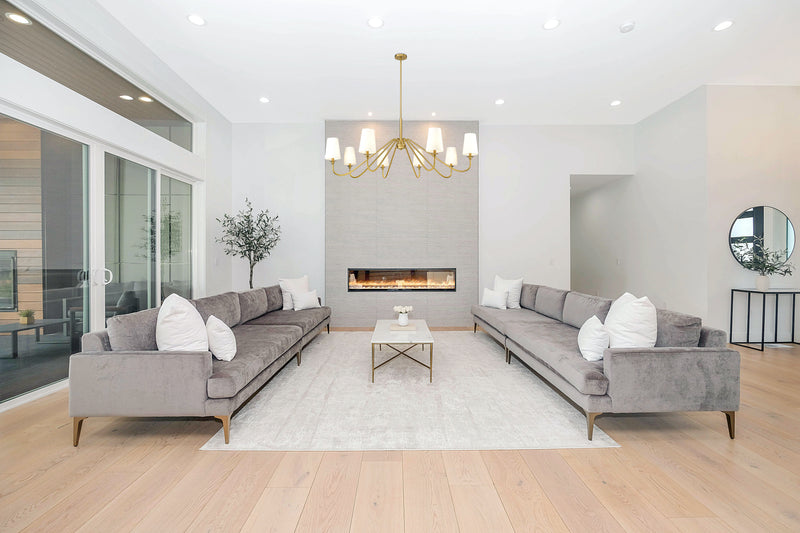 Gianna 8 Light 60.25" Chandelier in Modern Gold in a room setting