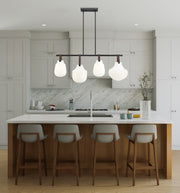 Newbury 4 Light 49.75" Pendant in Matte Black in a room setting