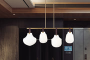 Newbury 4 Light 49.75" Pendant in Modern Gold in a room setting