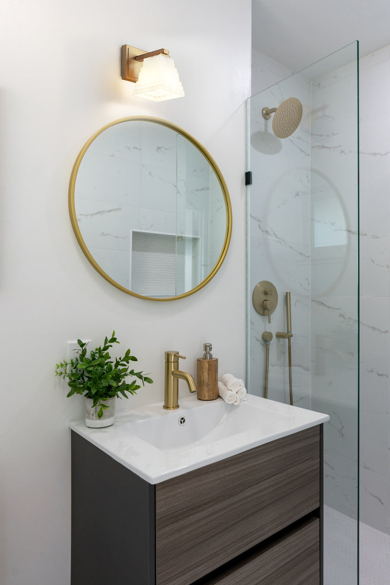 Annalise 1 Light 5" Wall Sconce in Modern Gold in a room setting
