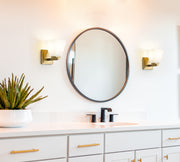 Annalise 1 Light 5" Wall Sconce in Modern Gold in a room setting