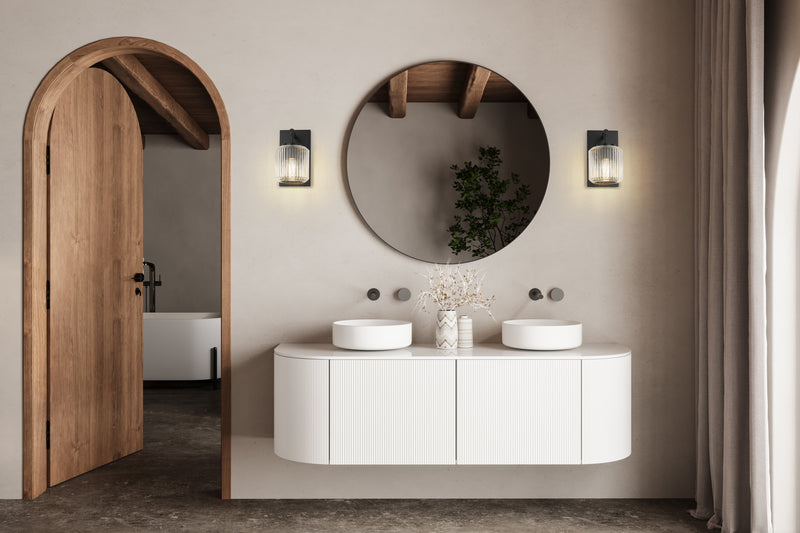 Landon 1 Light 5" Wall Sconce in Matte Black in a room setting