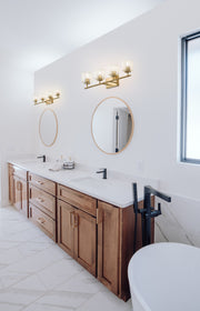 Landon 4 Light 32" Vanity in Modern Gold in a room setting