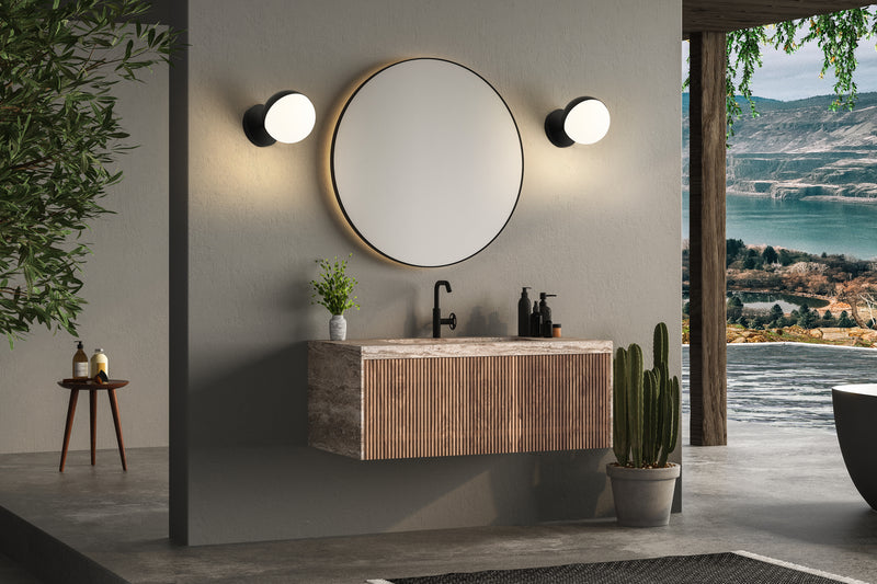 Realm Sphere 1 Light 6.25" Wall Sconce in Matte Black in a room setting