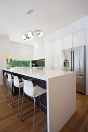 Realm Sphere 5 Light 42" Linear Pendant in Brushed Nickel in a room setting