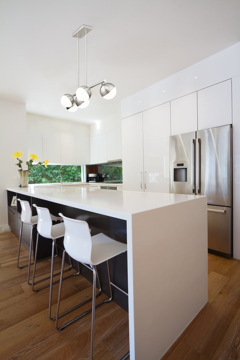 Realm Sphere 5 Light 42" Linear Pendant in Brushed Nickel in a room setting