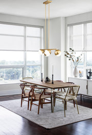 Realm Sphere 5 Light 42" Linear Pendant in Modern Gold in a room setting