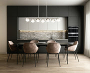 Realm Sphere 7 Light 54" Linear Pendant in Brushed Nickel in a room setting