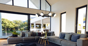 Realm Sphere 8 Light 44" Chandelier in Matte Black in a room setting