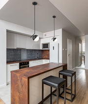 Realm Sphere 1 Light 8.5" Pendant in Matte Black in a room setting
