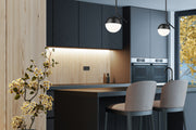 Realm Sphere 1 Light 8.5" Pendant in Matte Black in a room setting