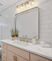 Belle 4 Light 32" Vanity in Modern Gold in a room setting