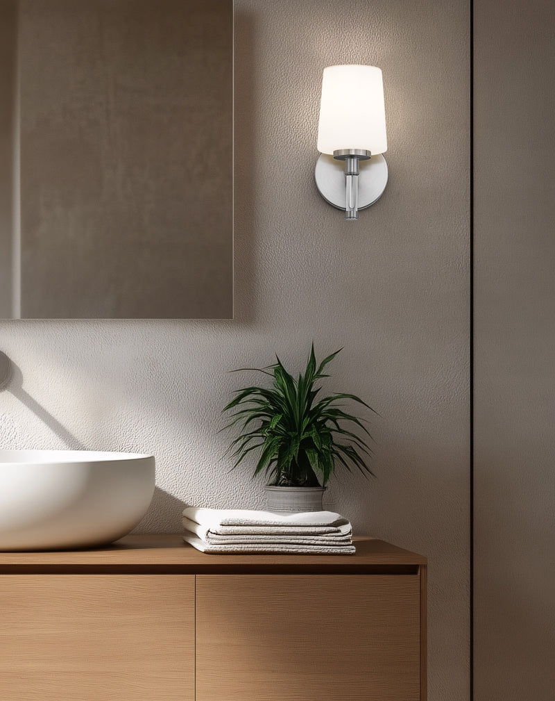Henri 1 Light 6.5" Vanity in Brushed Nickel in a room setting