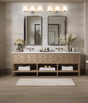 Henri 3 Light 24" Vanity in Brushed Nickel in a room setting