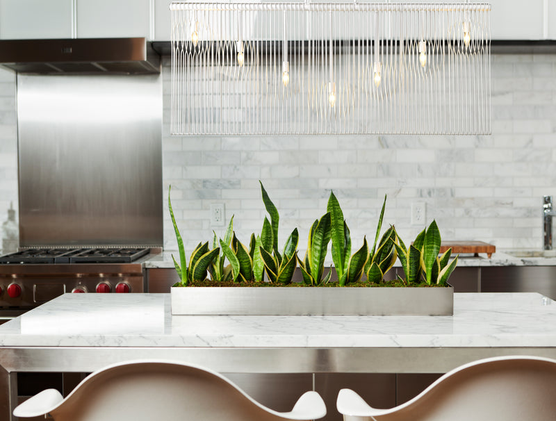 Contour 7 Light 62.75" Linear Pendant in White in a room setting