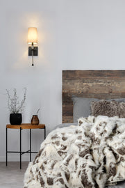 Sophia 1 Light 5.5" Wall Sconce in Matte Black in a room setting