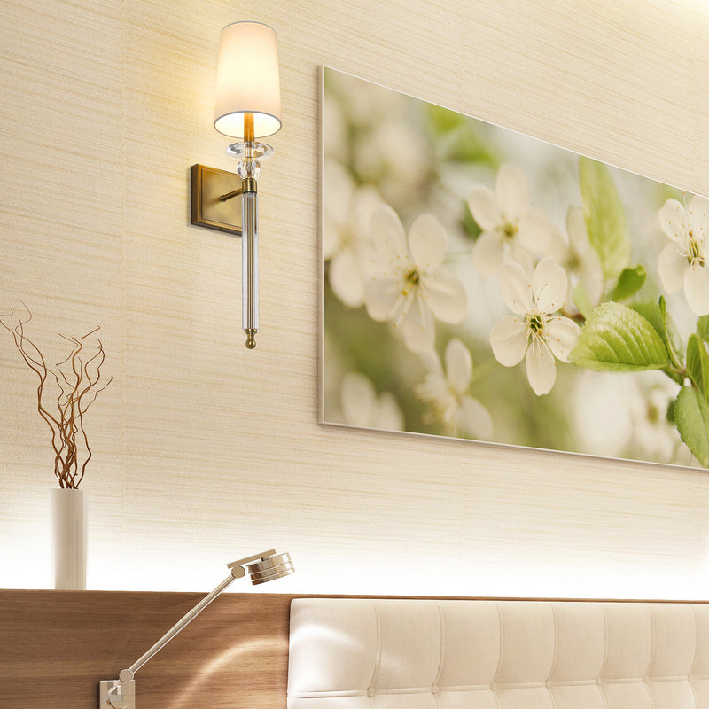 Ava 1 Light 5.5" Wall Sconce in Rubbed Brass in a room setting