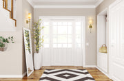 Ava 1 Light 5.5" Wall Sconce in Rubbed Brass in a room setting