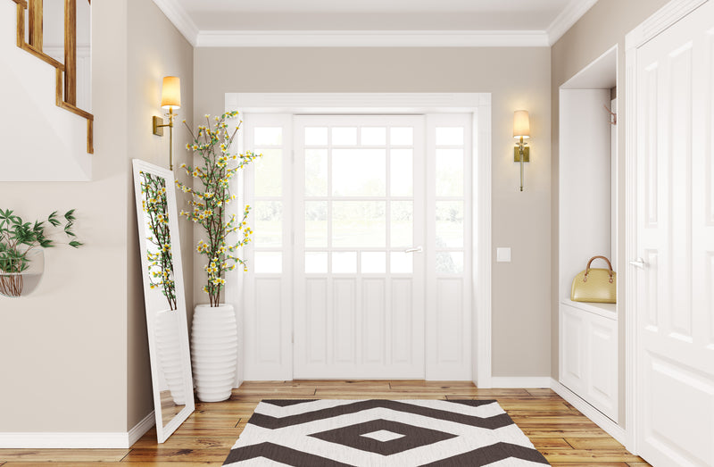 Ava 1 Light 5.5" Wall Sconce in Rubbed Brass in a room setting