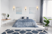 Mia 1 Light 5.5" Wall Sconce in Brushed Nickel in a room setting