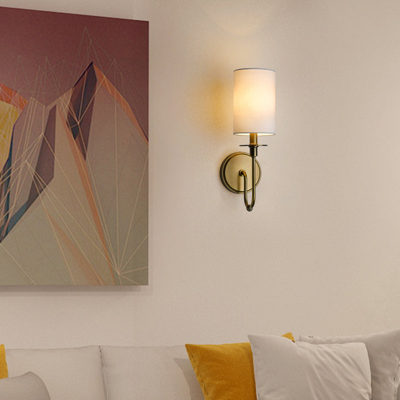 Ella 1 Light 5" Wall Sconce in Rubbed Brass in a room setting