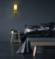 Ella 1 Light 5" Wall Sconce in Rubbed Brass in a room setting