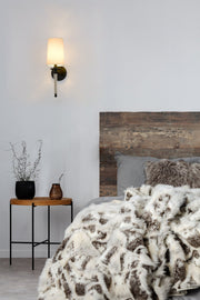 Avery 1 Light 5.5" Wall Sconce in Matte Black in a room setting