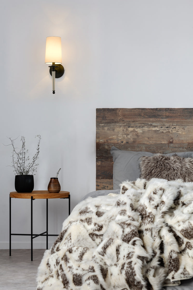 Avery 1 Light 5.5" Wall Sconce in Matte Black in a room setting