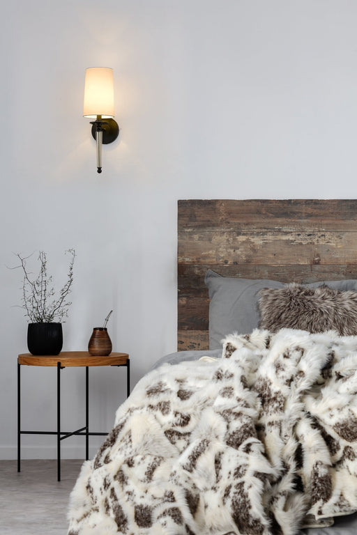 Avery 1 Light 5.5" Wall Sconce in Matte Black in a room setting