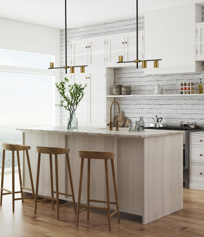 Calumet 3 Light 32" Linear Pendant in Matte Black + Olde Brass in a room setting