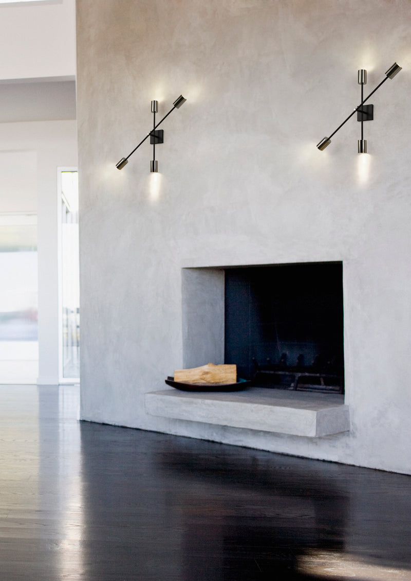 Calumet 4 Light 4.5" Wall Sconce in Matte Black + Polished Nickel in a room setting