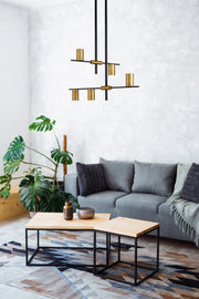 Calumet 5 Light 18" Chandelier in Matte Black + Olde Brass in a room setting