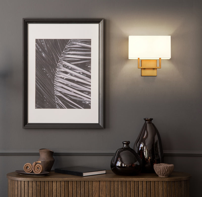 Saxon 2 Light 12" Wall Sconce in Rubbed Brass in a room setting