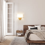 Saxon 2 Light 12" Wall Sconce in Rubbed Brass in a room setting