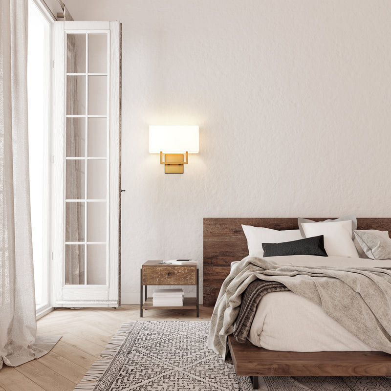 Saxon 2 Light 12" Wall Sconce in Rubbed Brass in a room setting