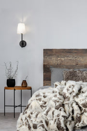 Winward 1 Light 6" Wall Sconce in Matte Black in a room setting