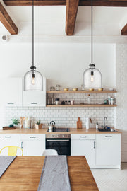 Pearson 1 Light Pendant, 16-16.5" Tall in Matte Black in a room setting