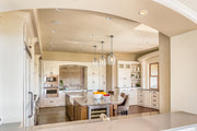 Pearson 1 Light Pendant, 13-13.5" Tall in Brushed Nickel in a room setting