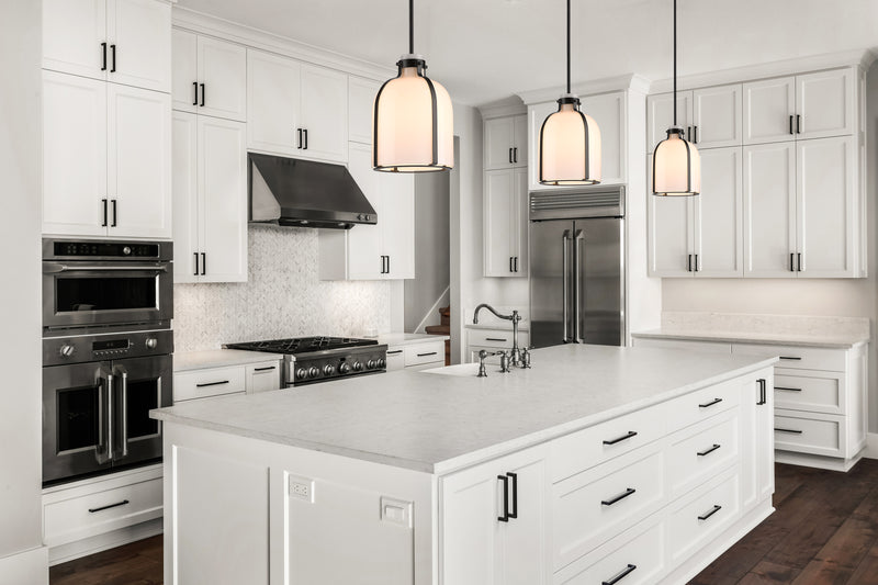 Pearson 1 Light Pendant, 13-13.5" Tall in Matte Black in a room setting