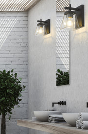 Lauren 1 Light 5" Wall Sconce in Matte Black in a room setting