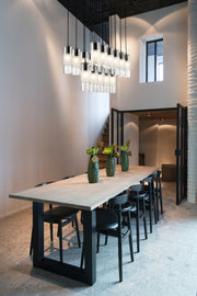 Alton 17 Light 42" Linear Pendant in Matte Black in a room setting