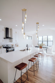 Alton 5 Light 12" Pendant in Modern Gold in a room setting