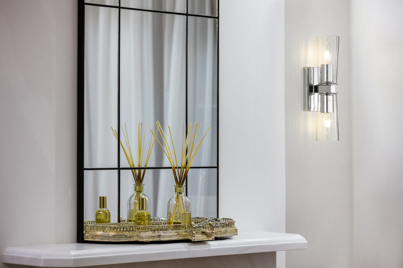 Titus 2 Light 4.5" Wall Sconce in Chrome in a room setting