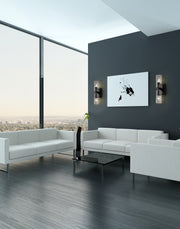 Titus 2 Light 4.5" Wall Sconce in Matte Black in a room setting