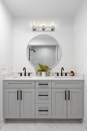 Titus 3 Light 24" Vanity in Brushed Nickel in a room setting