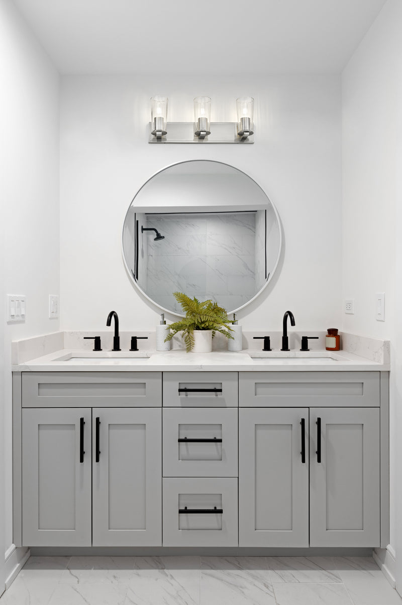 Titus 3 Light 24" Vanity in Brushed Nickel in a room setting