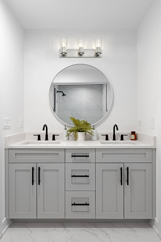 Titus 3 Light 24" Vanity in Brushed Nickel in a room setting