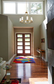 Titus 8 Light 33" Chandelier in Modern Gold in a room setting